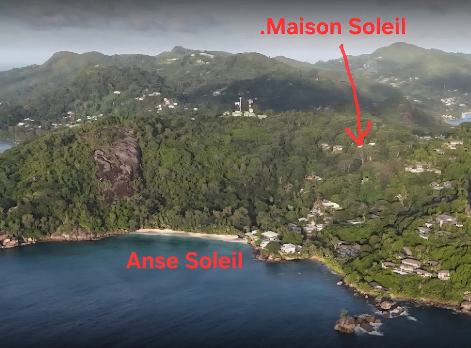 Aerial view of Anse Soleil bay with Maison Soleil on the forested hillside above turquoise water — Andrew Gee artist retreat, Baie Lazare at Maison Soleil, Anse Soleil, Seychelles (self-catering, Mahé)